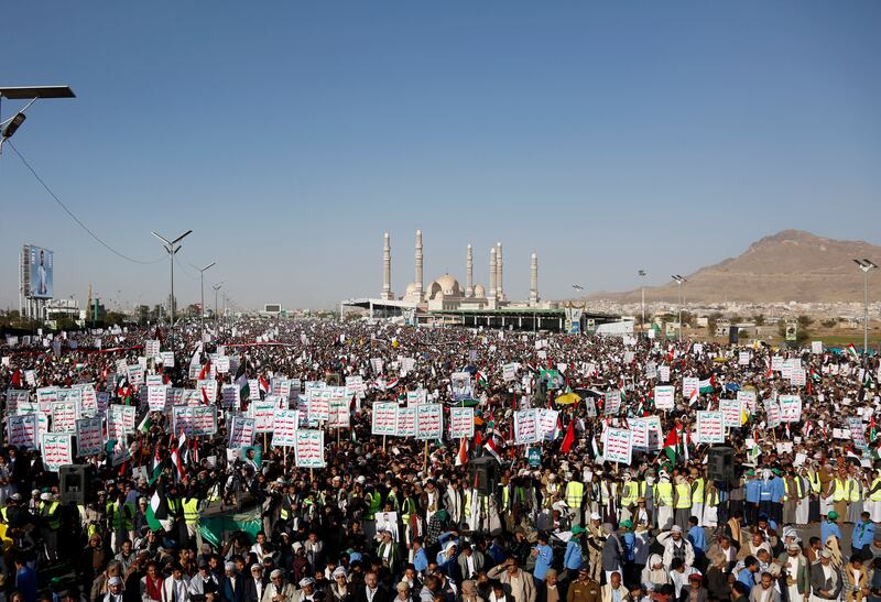 Houthi supporters attend a protest against the United States-led air strikes in Yemen (AP)