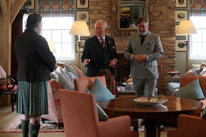 The then-Prince of Wales (centre) with Michael Fawcett (right) in 2019