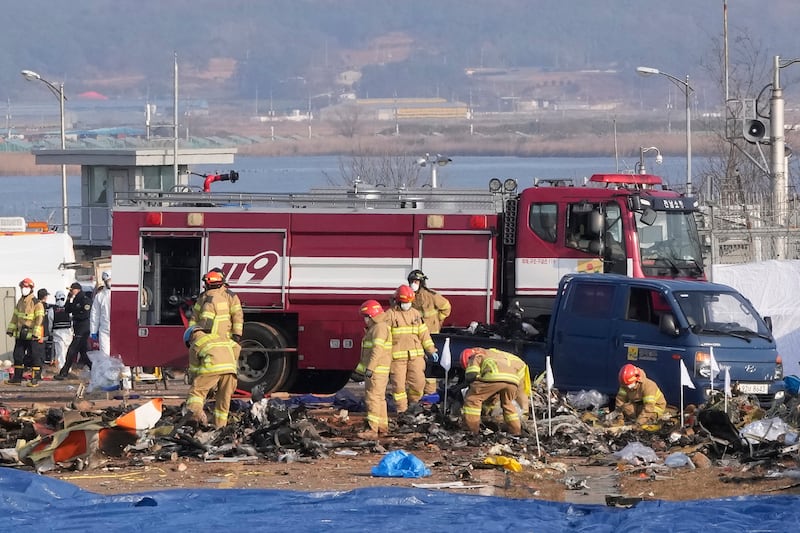 Emergency officials said the plane’s landing gear appeared to have malfunctioned (Ahn Young-joon/AP)