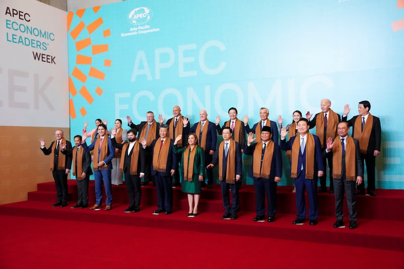 Apec leaders posing for a group photo (Sean Kilpatrick/The Canadian Press via AP)