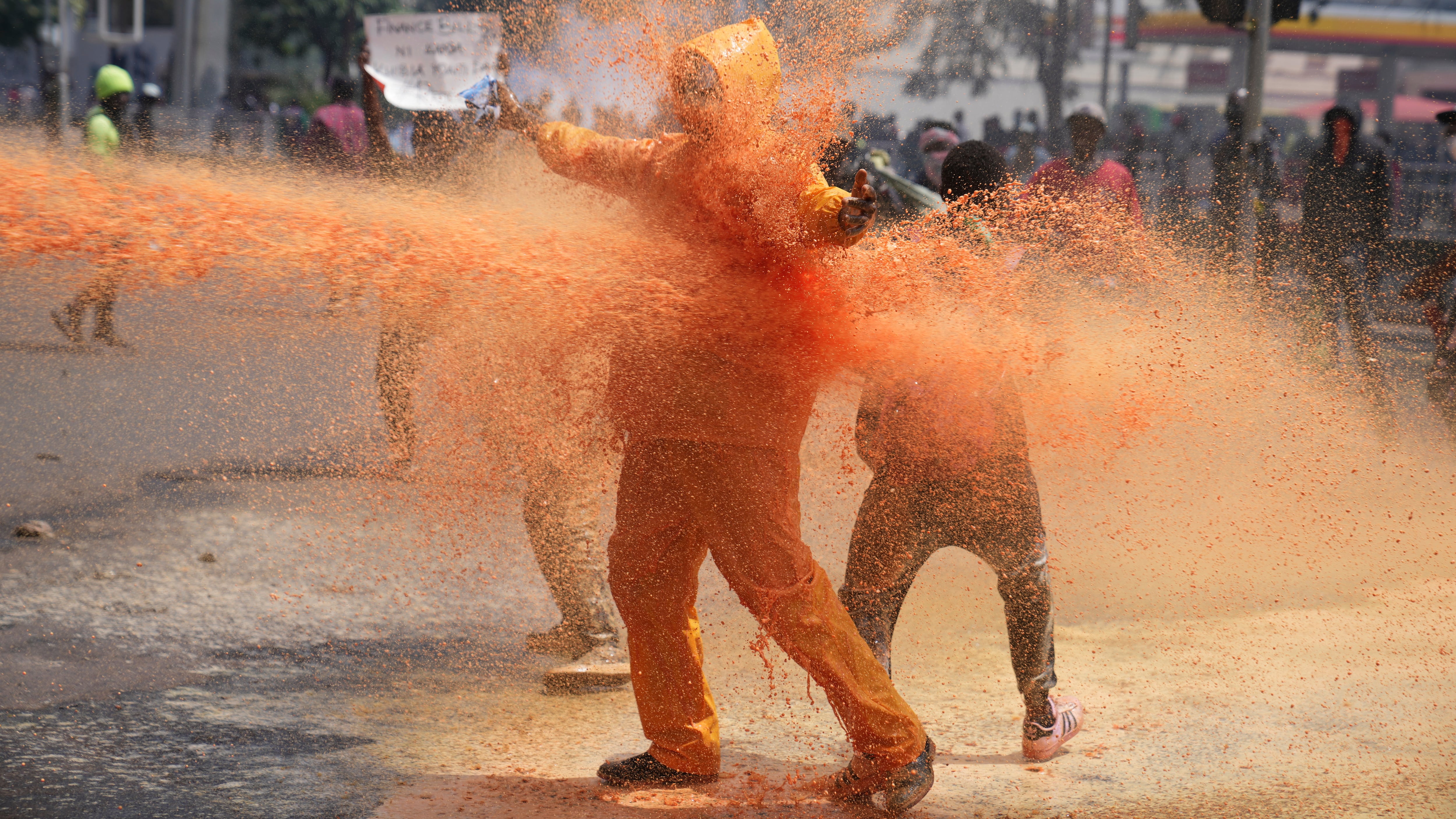 Police sprayed water cannon at the anti-tax protesters in Nairobi (Brian Inganga/AP)