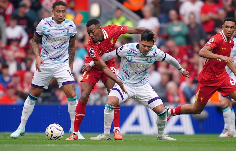 Ryan Gravenberch, second left, battles with Bournemouth’s Evanilson