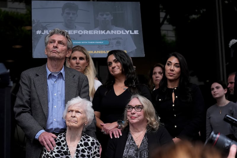 Family members together during the press conference (Damian Dovarganes/AP)