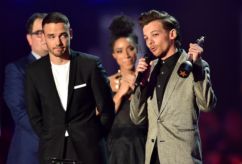 Liam Payne and Louis Tomlinson of One Direction collect the Best British Video award on stage during the 2016 Brit Awards