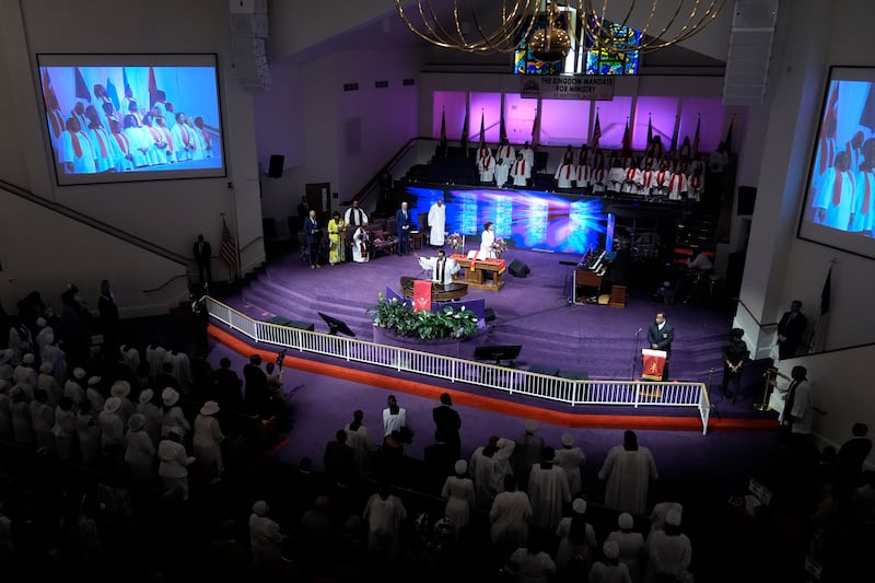 US President Joe Biden, standing in back row at second from right, attends a church service at Mount Airy Church of God in Christ in Philadelphia on Sunday (Manuel Balce Ceneta/AP)