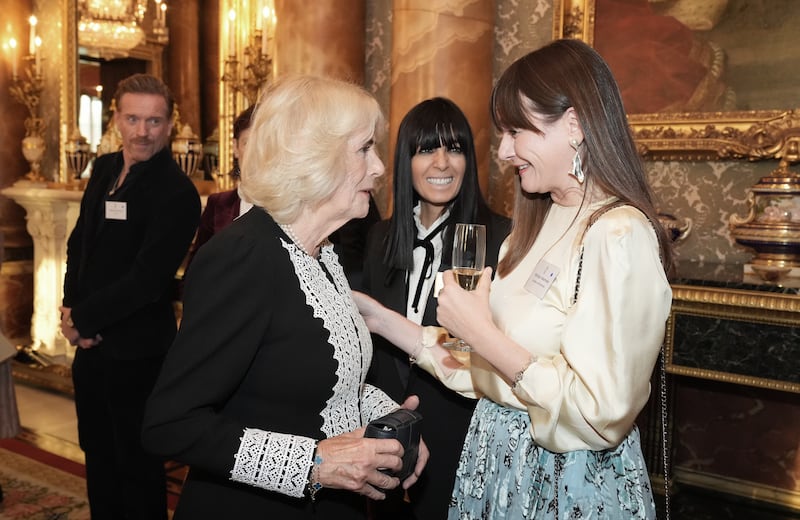 The Queen speaks to Emily Mortimer during a reception to mark the centenary of the Film and TV charity, at Buckingham Palace, London