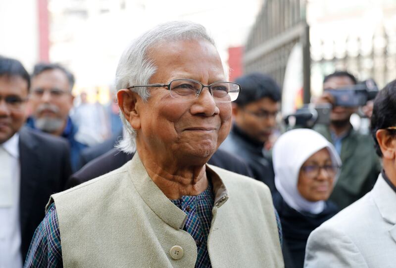 Nobel Peace Prize laureate Muhammad Yunus smiles as he arrives to appear before a labour court in January (Mahmud Hossain Opu/AP)