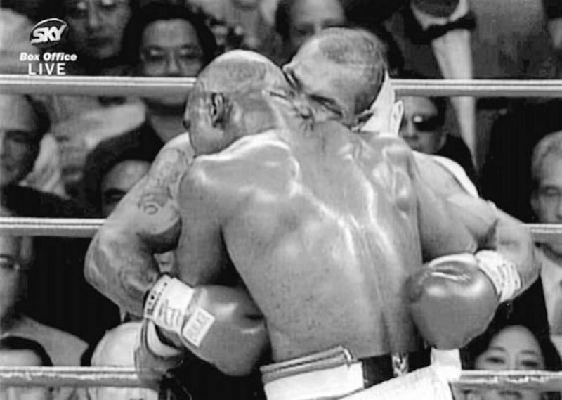 BITE NIGHT.....Mike Tyson launching his biting assault on Evander Holyfield during their World Heavyweight title clash in Las Vegas in June 1997 