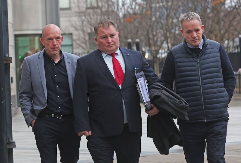 Brothers Brian (left)  and Edward (right)  of Francis Bradley with Solicitor Ciaran Shiels after the findings of an inquest at Laganside Court in Belfast.
PICTURE COLM LENAGHAN