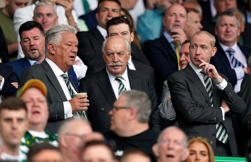 Dermot Desmond, centre, flanked by chairman Peter Lawwell and chief executive Michael Nicholson, right