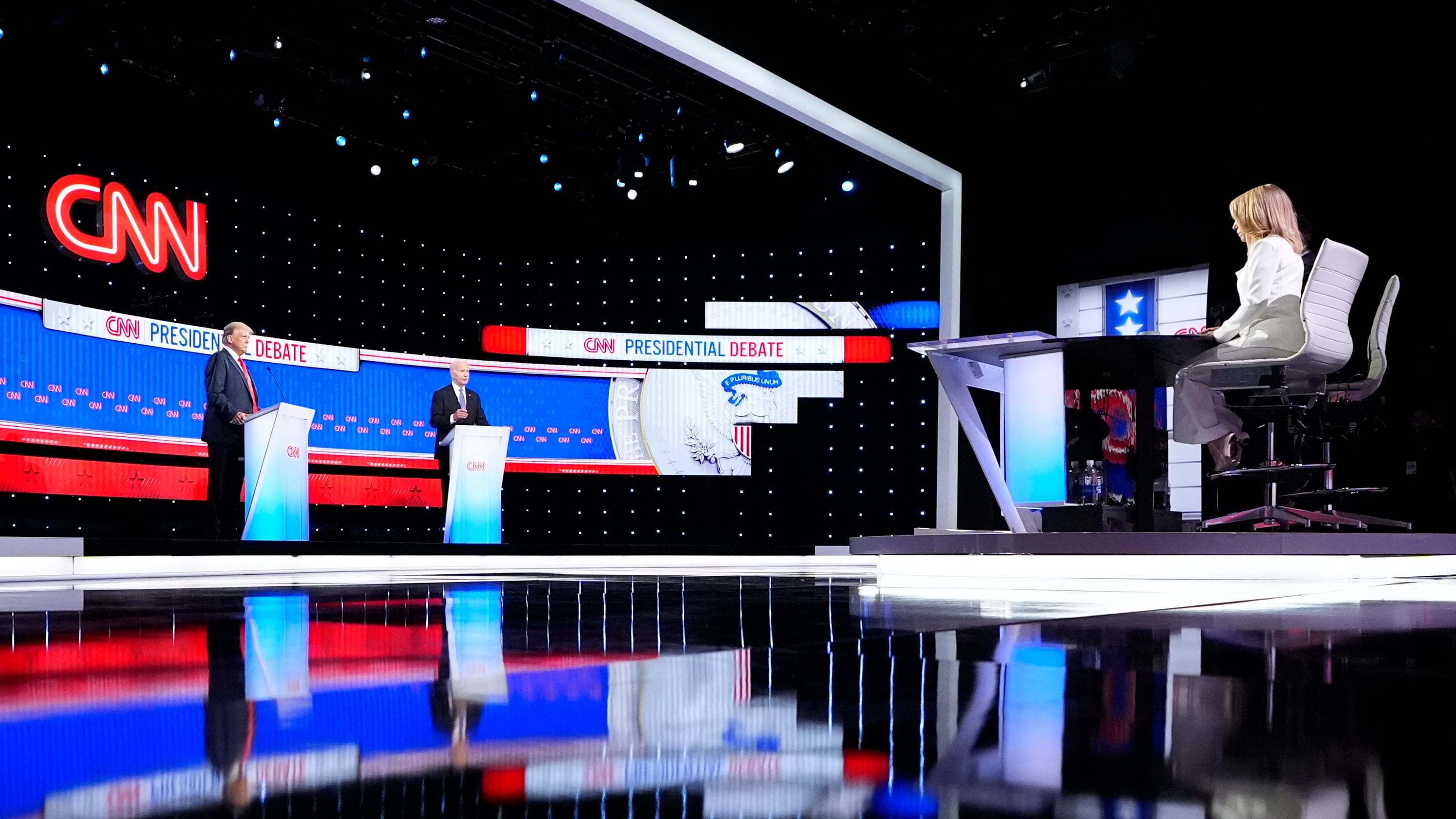 US President Joe Biden, stage right, and Republican presidential candidate former president Donald Trump, stage left, take part in a presidential debate (Gerald Herbert/AP)