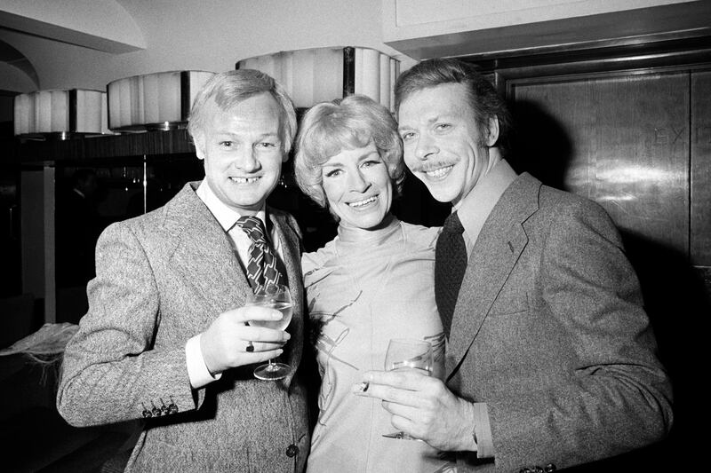 From left, actor John Inman, Yootha Joyce and Brian Murphy in 1977