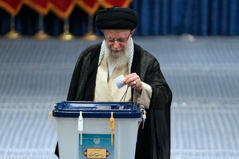 Iran’s supreme leader Ayatollah Ali Khamenei cast his vote in the election (Vahid Salemi/AP)