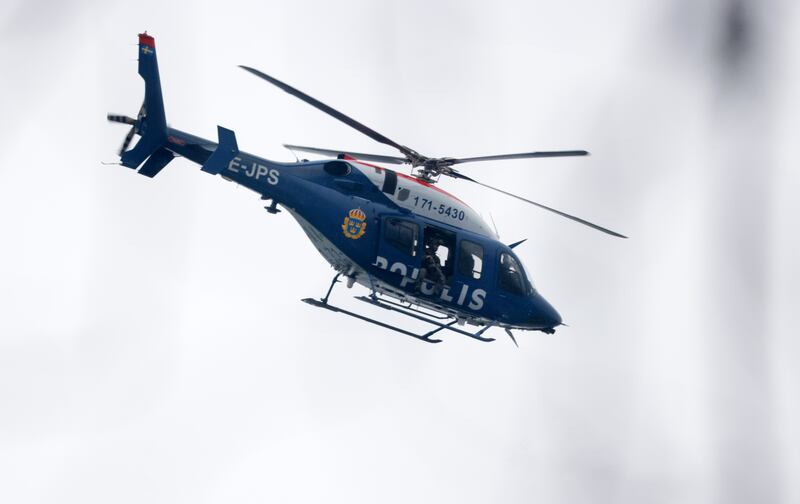 A helicopter at the scene of an incident at Risbergska School, in Orebro, Sweden (Kicki Nilsson/TT News Agency via AP)