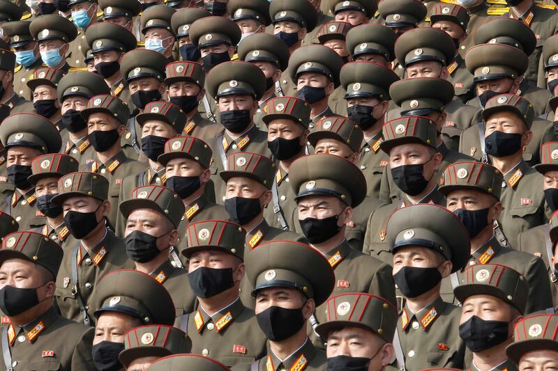 FILE – Soldiers wearing face masks in Pyongyang, North Korea, 2020. (AP Photo/Jon Chol Jin, File)