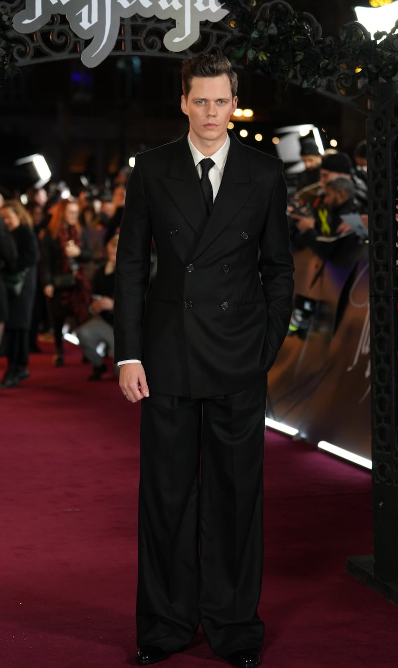 Bill Skarsgard wore an all black retro-inspired suit