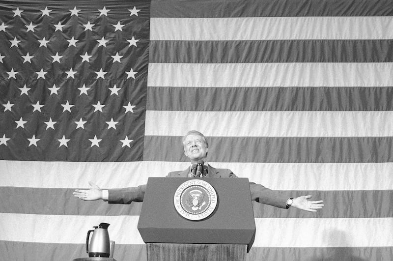 President Jimmy Carter acknowledges the applause of about 1,100 people gathered in the Elk City High School gym for a town meeting in Elk City, Oklahoma