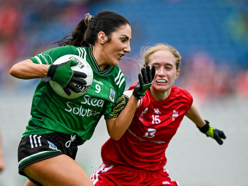 Lisa Maguire vying for possession with a Louth player during the All-Ireland JFC final