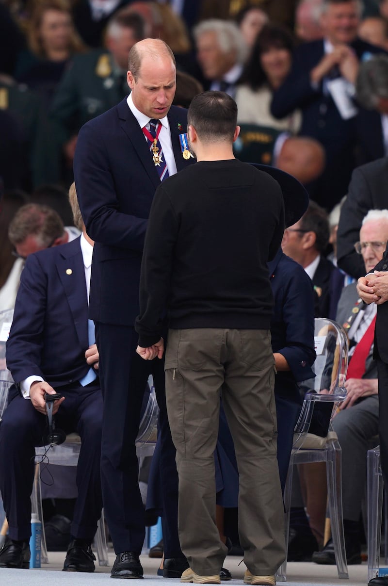 The Prince of Wales talks to Ukrainian President Volodymyr Zelensky as they attend the official international ceremony to mark the 80th anniversary of D-Day at Omaha Beach in Saint-Laurent-sur-Mer, Normandy, France