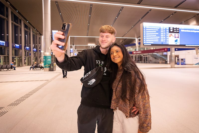 Morgan Maggee and Anna Harris from Banbridge were among the first passengers as services at the new Grand Central Station opened in Belfast this morning.  Picture by Brian Morrison.