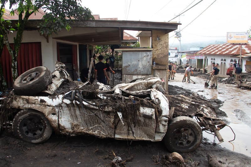 A vehicle damaged by a flash flood in Agam, West Sumatra, Indonesia (Sutan Malik Kayo/AP)