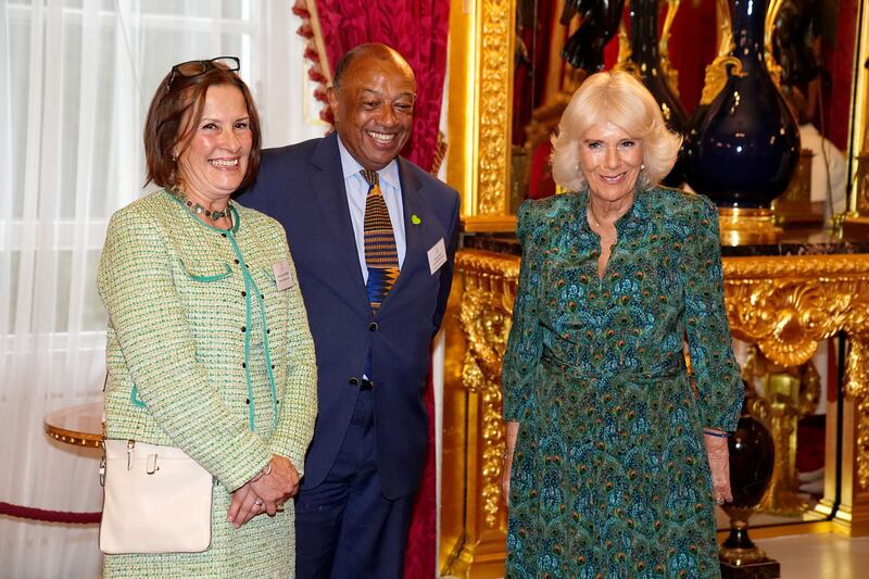 The Queen, patron of Book Aid International, stands with the charity’s vice patron Lord Boateng and chief executive Alison Tweed during the charity’s 70th anniversary reception at St James’s Palace