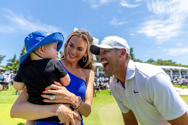 Brooks Koepka celebrates with his family after winning the LIV Golf event in Singapore (Jon Ferrey/LIV Golf via AP)