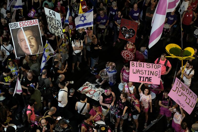 People in Tel Aviv protest against Israeli Prime Minister Benjamin Netanyahu’s government and call for the release of hostages held in the Gaza Strip by the Hamas militant group (Mahmoud Illean/AP)