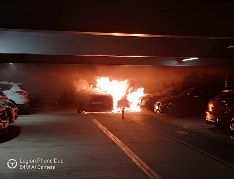 The vehicle on fire on the third floor of the car park