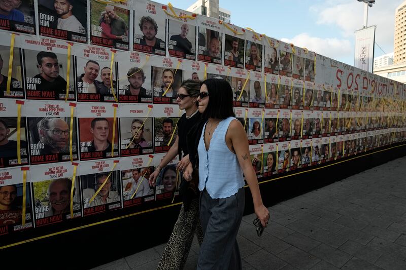 Posters of hostages taken on October 7 (Tsafrir Abayov/AP)