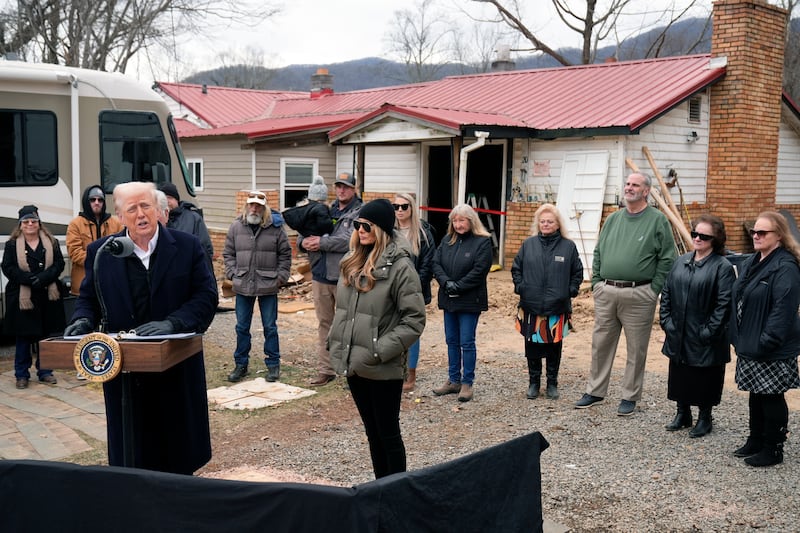 President Donald Trump speaks along side first lady Melania Trump, as they meet with homeowners affected by Hurricane Helene in Swannanoa (Mark Schiefelbein/AP)