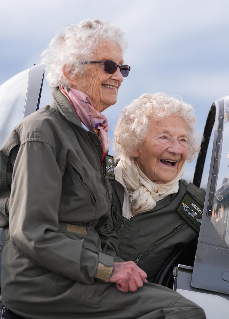 Robbie Hall and Dorothea Barron pose next to a Spitfire