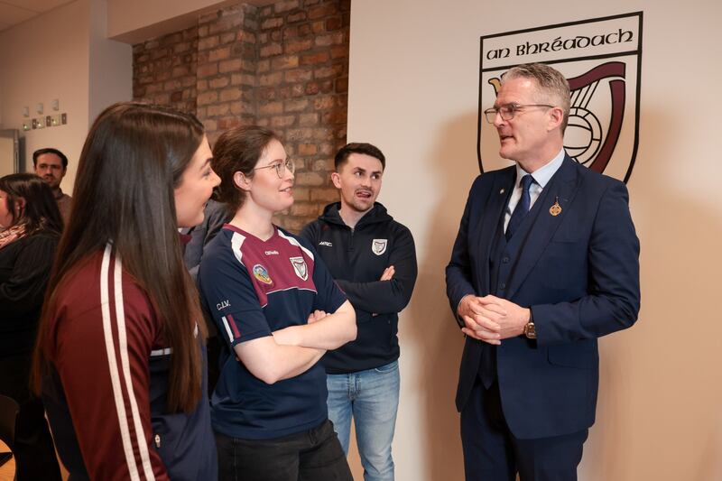 GAA President Jarlath Burn talks to club members during the opening of Bredagh's new clubrooms