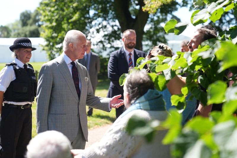 The King speaks with well-wishers after attending a Sunday church service at St Mary Magdalene Church in Sandringham