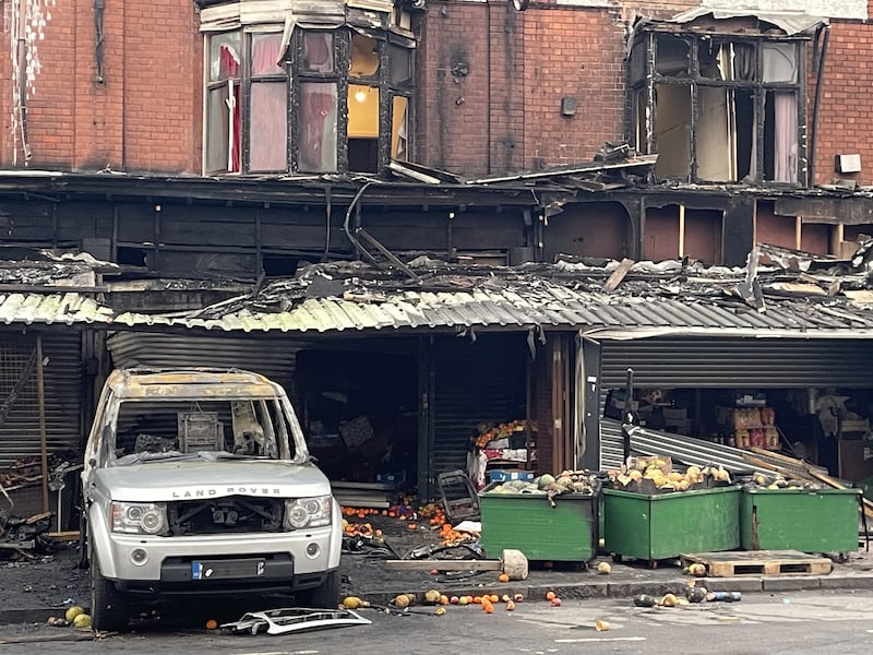 The remains of a burnt-out car at the scene of the fire