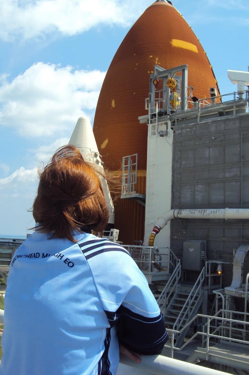 Woman wearing blue Mayobridge GAC shirt at the Kennedy Space Center in Florida