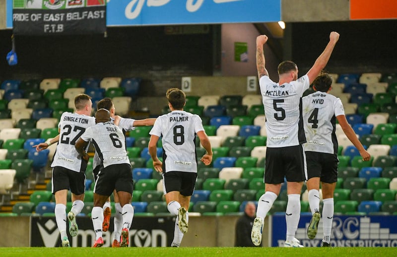 Jay Donnelly celebrates with his teammates as Glentoran levels the scoring during their game at Windsor Park, Belfast