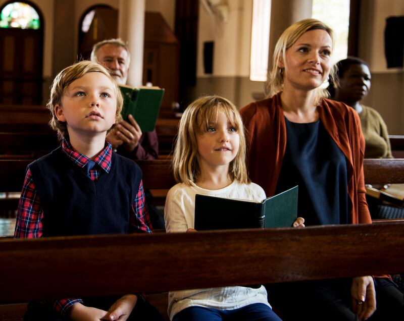 A woman and two children at a church service