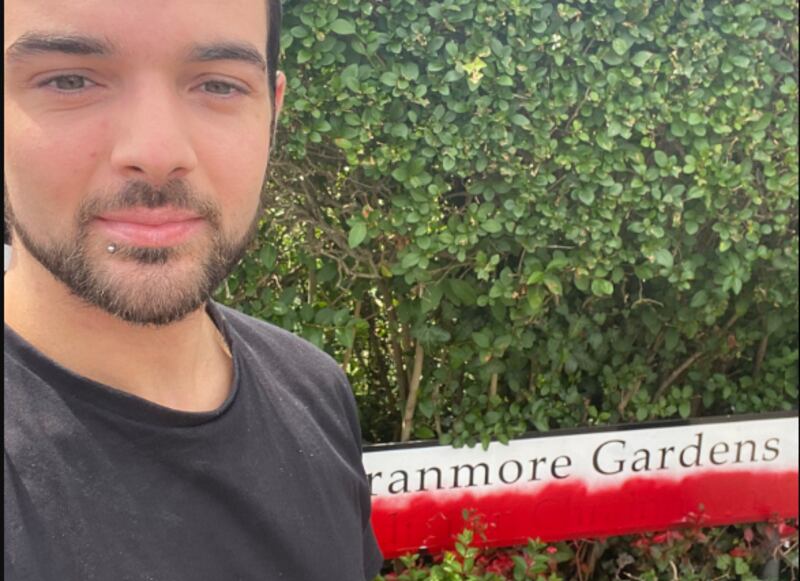 Belfast Lord Mayor Mickey Murray pictured with the defaced street sign at Cranmore Gardens in Belfast. PICTURE: MICKEY MURRAY/X