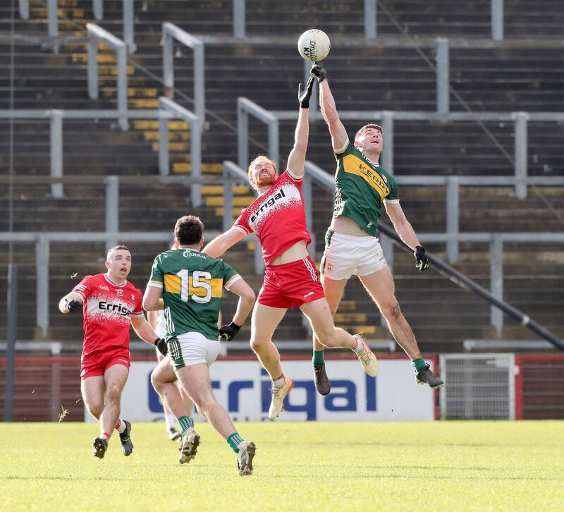 Derry Conor Glass with Diarmuid O'Connor of Kerry during the NFL Div 1 round 2 match played at Celtic Park