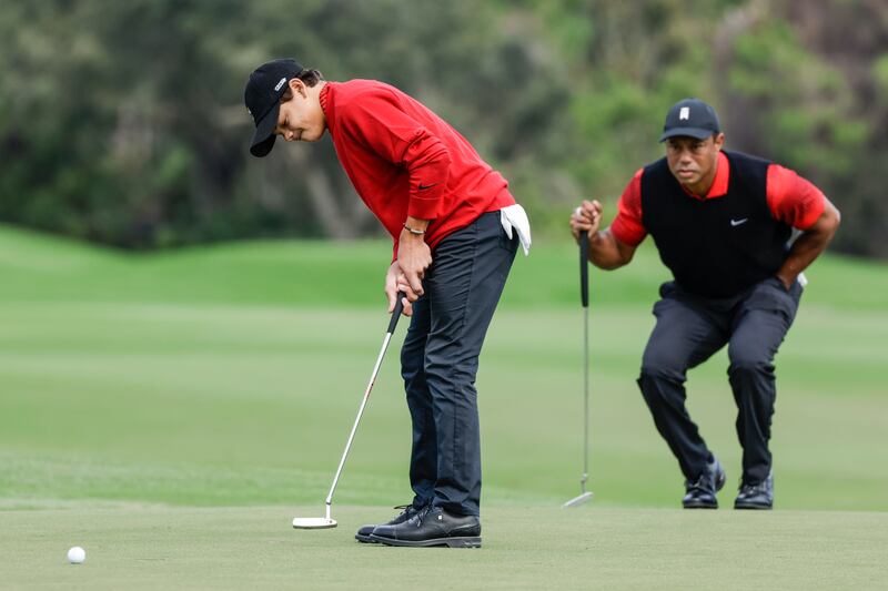 Tiger Woods, right, and his son Charlie Woods shot 64 in the first round of the PNC Championship (Kevin Kolczynski/AP)