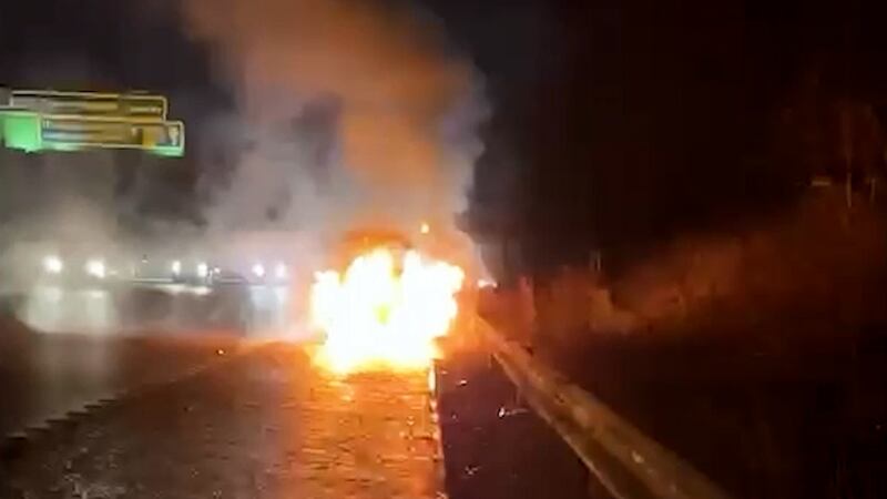 Screen grab taken from a video of Mark Gordon and Constance Marten’s burning Peugeot 206 on the M61