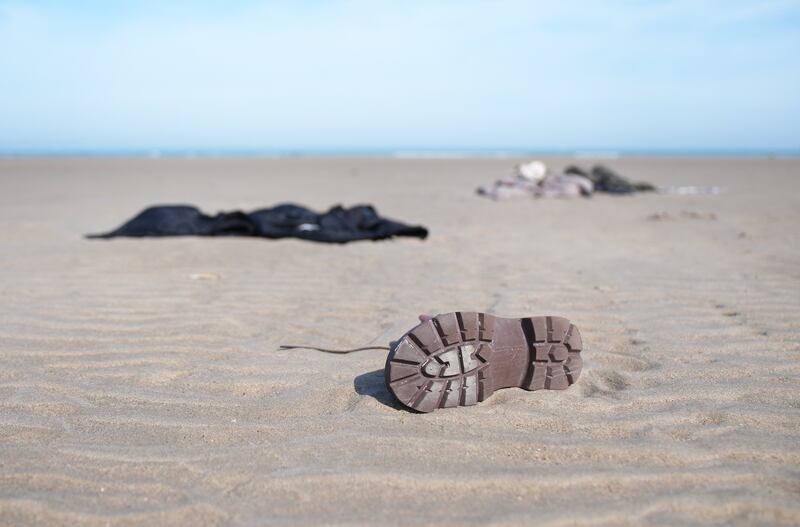 Belongings of people thought to be migrants are left on the beach in Gravelines, France, after they boarded a small boat to cross the Channel