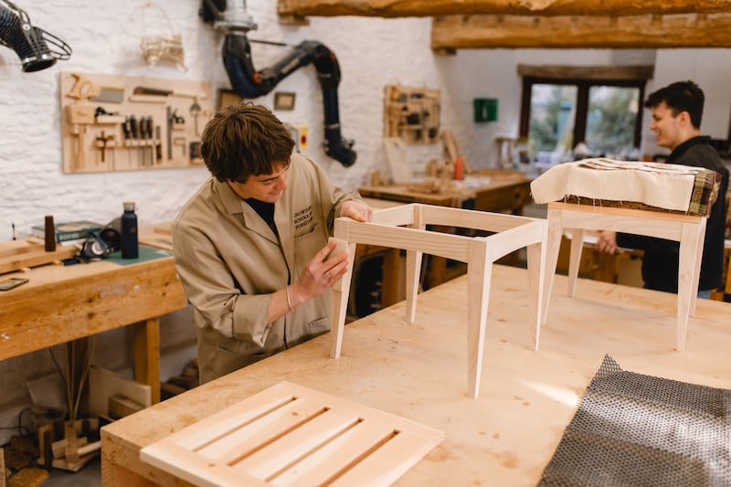 Graduates working on the stools at Highgrove