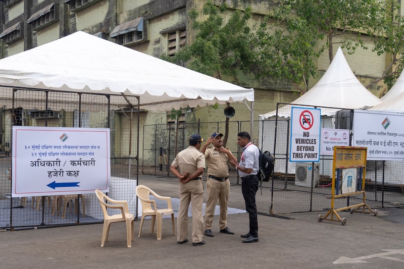 Police officers stand guard at a vote counting centre ahead of the counting for Indian parliamentary elections in Mumbai, India (Rafiq Maqbool/AP)