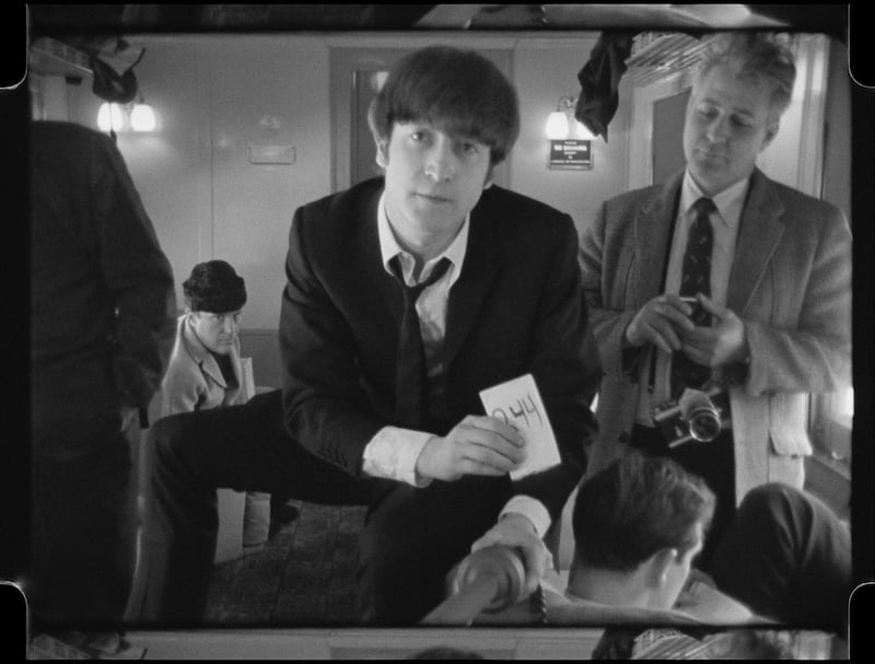 John Lenon in Disney's BEATLES '64. © 2024 Apple Corps, Ltd.  All Rights Reserved.