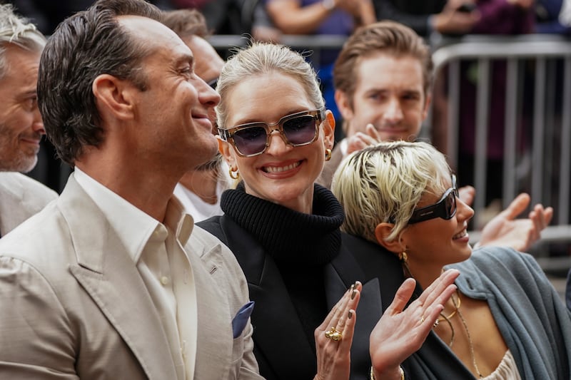 Jude Law, from left, Phillipa Coan, and Iris Law attend a ceremony honouring Jude Law with a star on the Hollywood Walk (Jordan Strauss/Invision/AP)