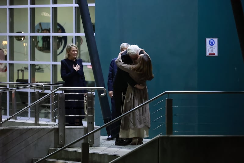 WikiLeaks founder Julian Assange embraces his wife Stella as he arrives in Canberra