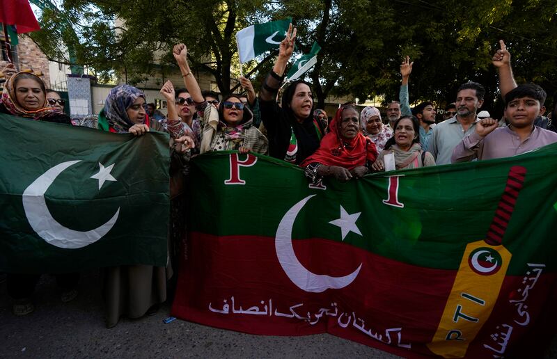 Supporters of imprisoned Imran Khan’s party hold a protest (Fareed Khan/AP)