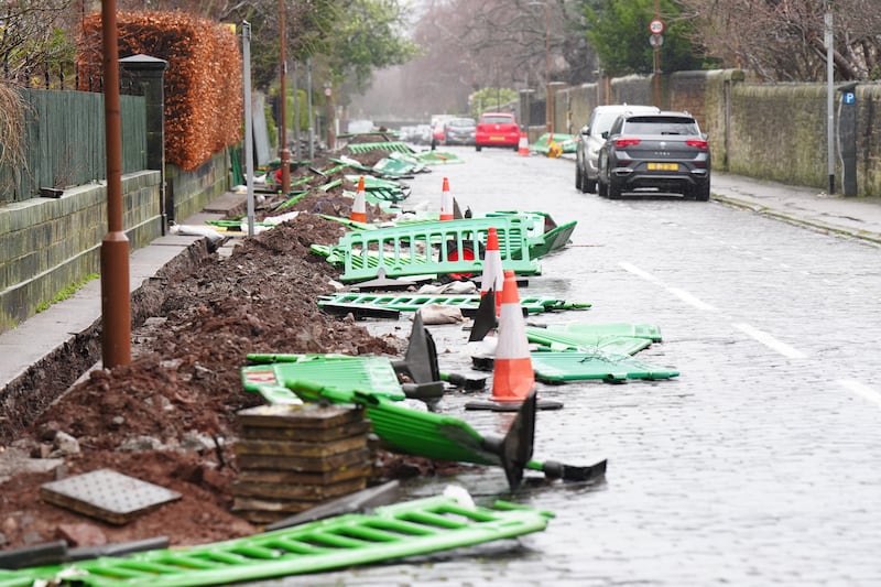 Temporary barriers blown down by the wind in Hope Terrace, Edinburgh